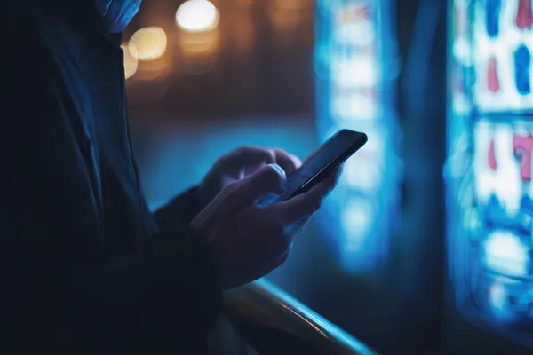 A glamorous woman holding casino chips in a neon-lit environment, representing the premium online casino atmosphere of OKTKBD.