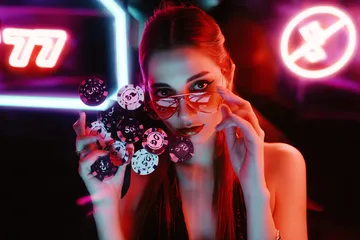 A close-up shot of golden coins falling around a spinning roulette wheel, representing immersive casino action at OKTKBD.