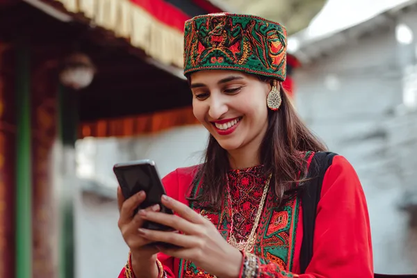 A person using their device against a moody casino-themed background, illustrating the smooth re-entry process at OKTKBD.